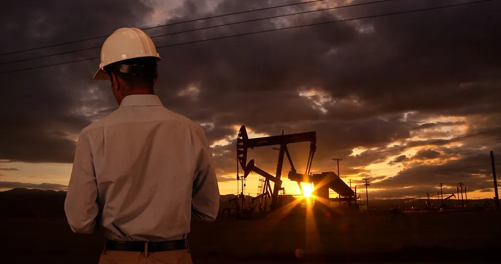 Oilfield worker near oil rig.