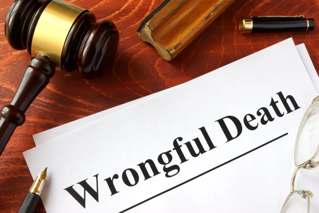 Document titled "Wrongful Death" on a desk with a gavel.