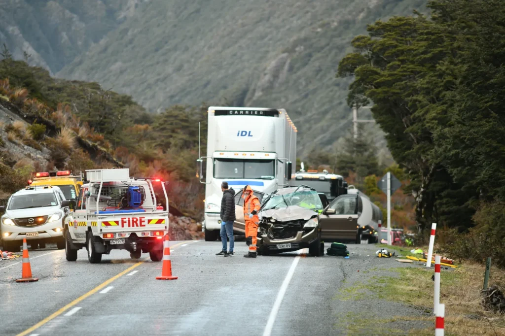 A truck accident scene in the middle of the road. 