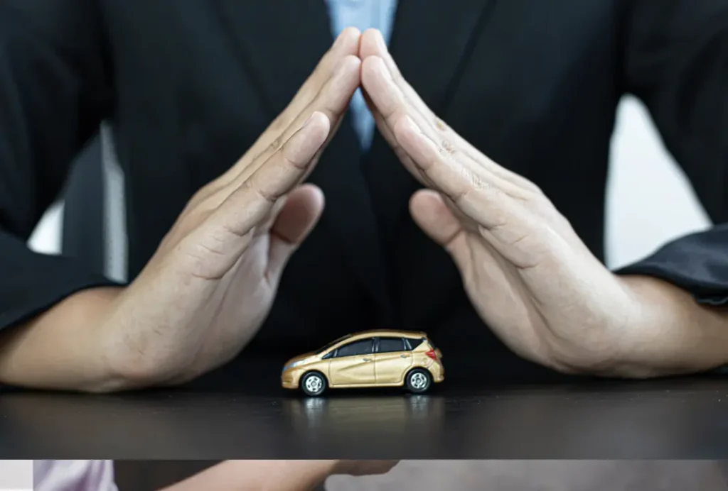 Toy car covered by lawyer's hands.