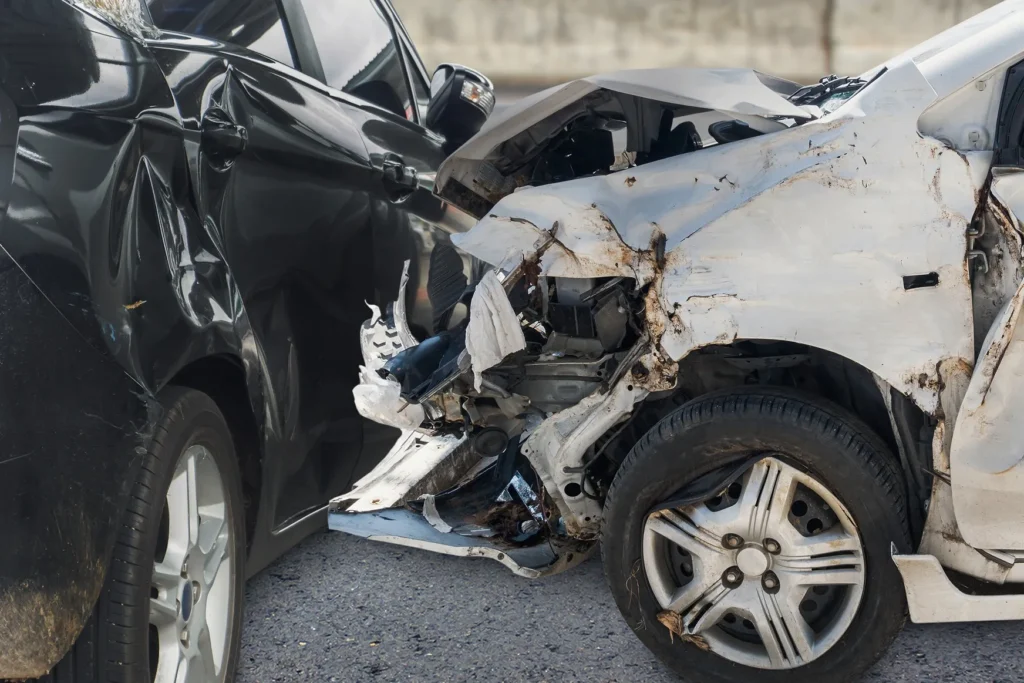 Two heavily damaged vehicles after a collision, illustrating the severity and types of car accidents that can occur on roads in San Antonio.